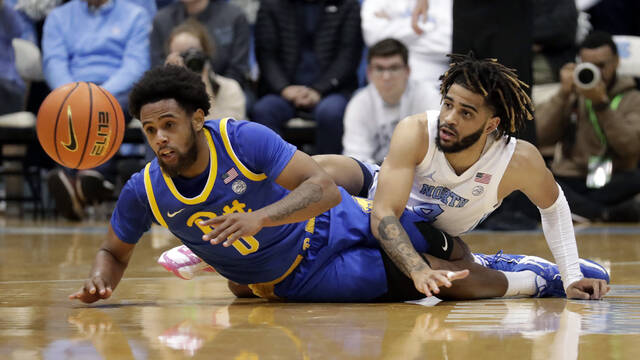 Pitt guard Nelly Cummings (0) and North Carolina guard R.J. Davis (4) go for a loose ball during the first half Wednesday, Feb. 1, 2023, in Chapel Hill, N.C.