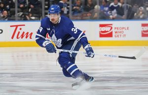 TORONTO, CANADA - JANUARY 25: Auston Matthews #34 of the Toronto Maple Leafs looks for a return pass against the New York Rangers during an NHL game at Scotiabank Arena on January 25, 2023 in Toronto, Ontario, Canada. The Maple Leafs defeated the Rangers 3-2 in overtime. (Photo by Claus Andersen/Getty Images)