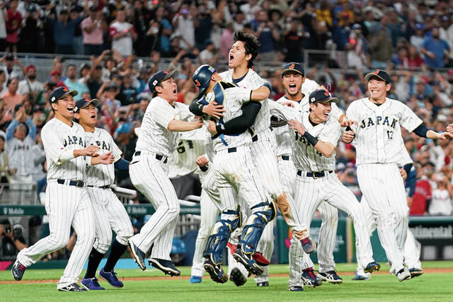 Japan player Shohei Ohtani celebrates Tuesday with teammates after defeating the U.S. in the World Baseball Classic championship game in Miami.
