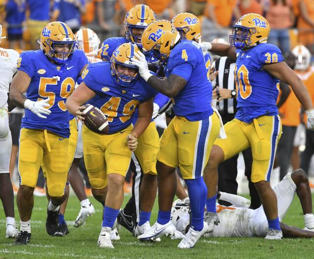 Pitt’s Nahki Johnson celebrates with Byron Floyd after Floyd’s fumble recovery on a muffed punt by Tennessee’s Trevon Flowers in the fourth quarter Saturday, Sept. 10, 2022, at Acrisure Stadium.