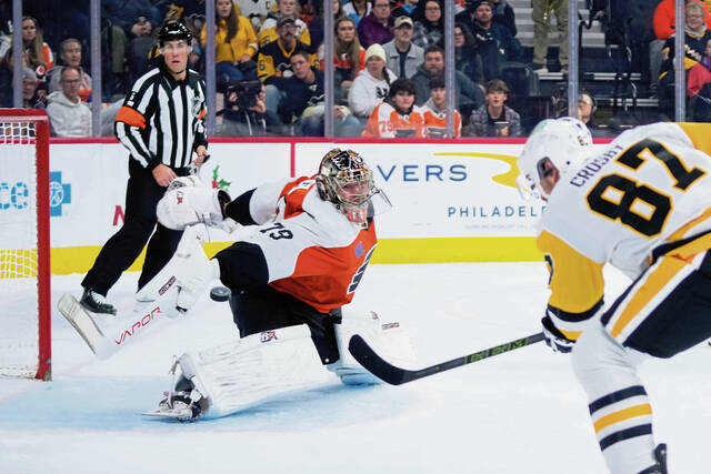 The Penguins’ Sidney Crosby scores past Flyers goalie Carter Hart in the first period Monday. The goal gave Crosby 125 career points against the Flyers, the most by one player against Philadelphia in NHL history.