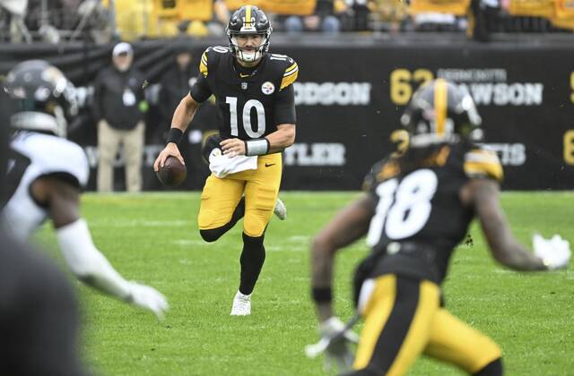 The Steelers’ Mitch Trubisky looks to throw to Diontae Johnson but runs against the Jaguars in the third quarter Sunday Oct. 29, 2023 at Acrisure Stadium.