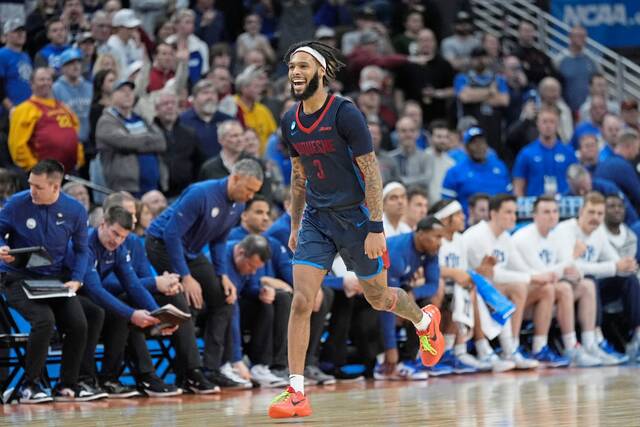 Duquesne guard Dae Dae Grant celebrates after a 71-67 win over BYU in the NCAA Tournament on Thursday in Omaha, Neb.