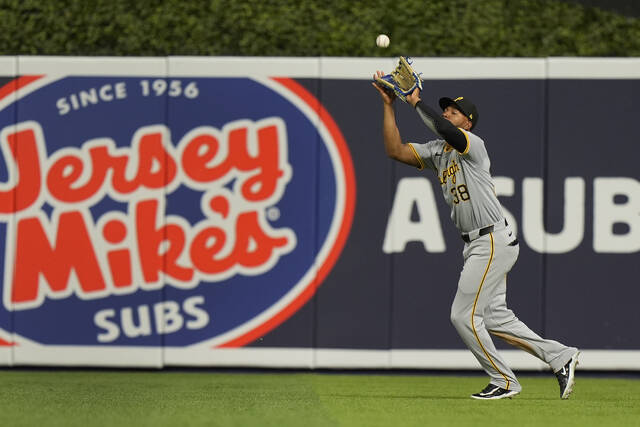 Pirates right fielder Edward Olivares catches a ball hit by Miami’s Christian Bethancourt during the third inning Friday.