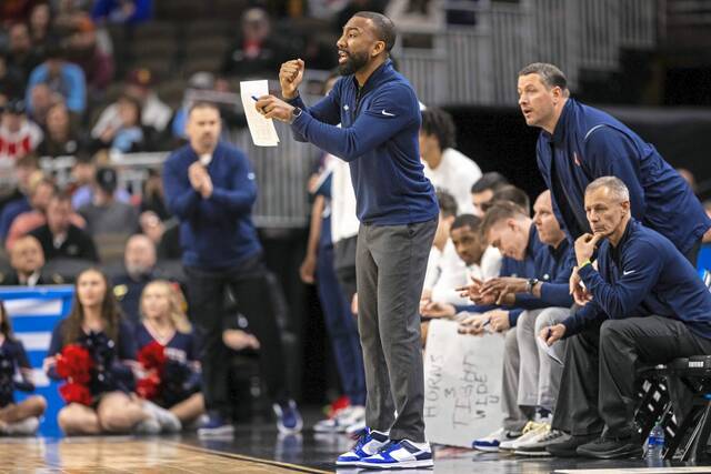Duquesne’s Dru Joyce III coaches from the sideilne against BYU on March 21, 2024.