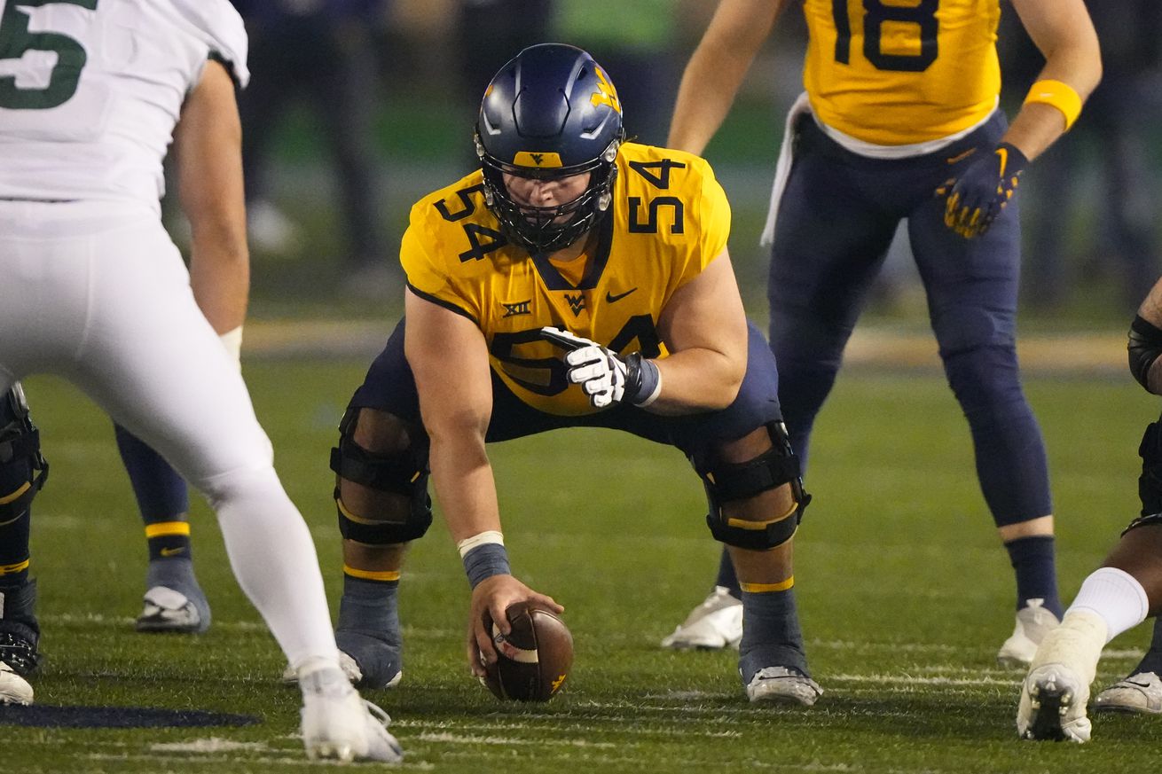 West Virginia Mountaineers Offensive Lineman Zach Frazier (54) lines up for a play during the second half of the college football game between the Baylor Bears and the West Virginia Mountaineers on October 13, 2022, at Mountaineer Field at Milan Puskar Stadium in Morgantown, WV.