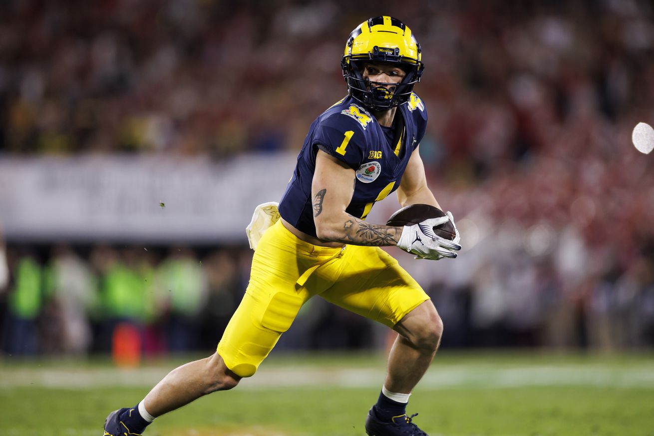 Wide receiver Roman Wilson #1 of the Michigan Wolverines runs the ball after a catch during the CFP Semifinal Rose Bowl Game against the Alabama Crimson Tide at Rose Bowl Stadium on January 1, 2024 in Pasadena, California.