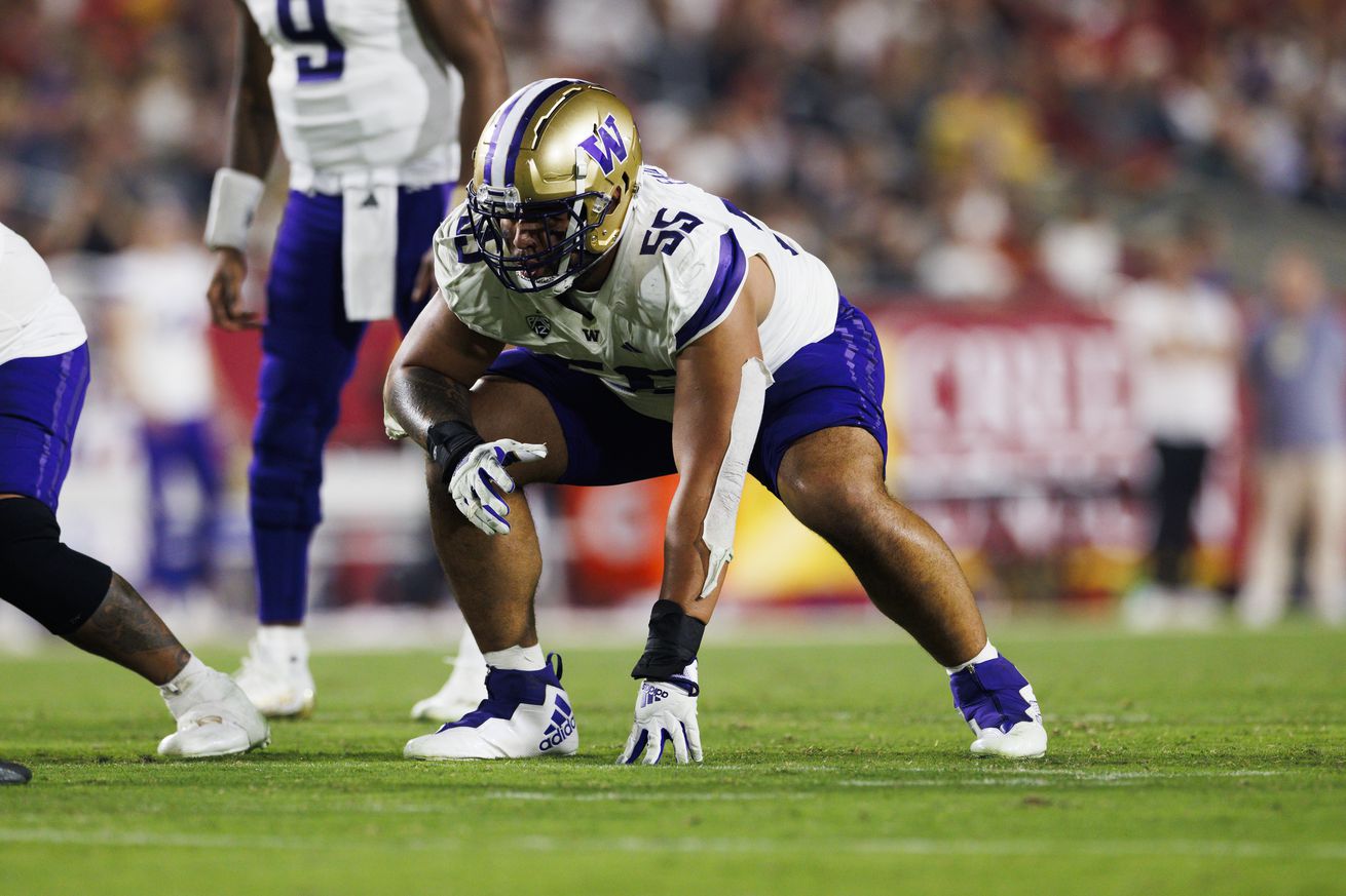 Troy Fautanu #55 of the Washington Huskies in an offensive stance during a game against the USC Trojans at United Airlines Field at the Los Angeles Memorial Coliseum on November 04, 2023 in Los Angeles, California.