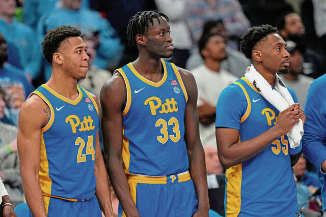 Member of the Pitt men’s basketball team, from left, William Jeffress (24), Federiko Federiko (33) and Zack Austin (55) at the end of their loss to North Carolina during an NCAA college basketball game in the semifinal round of the Atlantic Coast Conference tournament Friday, March 15, 2024, in Washington.
