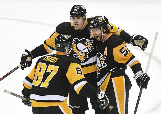 Penguins forwards Sidney Crosby and Evgeni Malkin (No. 71) as well as defenseman Kris Letang appeared in 82 games this season.