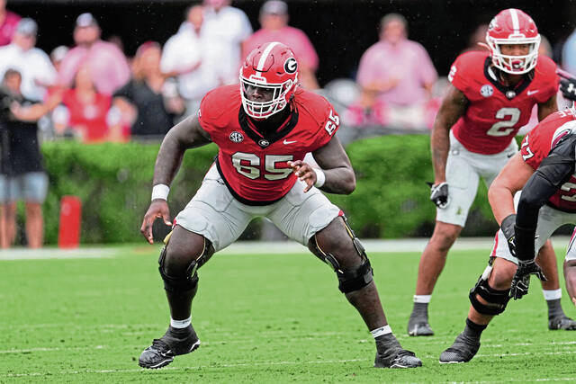 Georgia offensive lineman Amarius Mims (65) is shown aginst South Carolina during the first half of an NCAA college football game Saturday, Sept. 16, 2023, Ga.