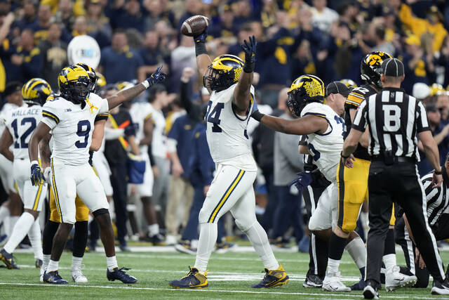 Michigan defensive lineman Kris Jenkins celebrates Dec. 2 after recovering a fumble in the first half of the Big Ten championship game against Iowa in Indianapolis.