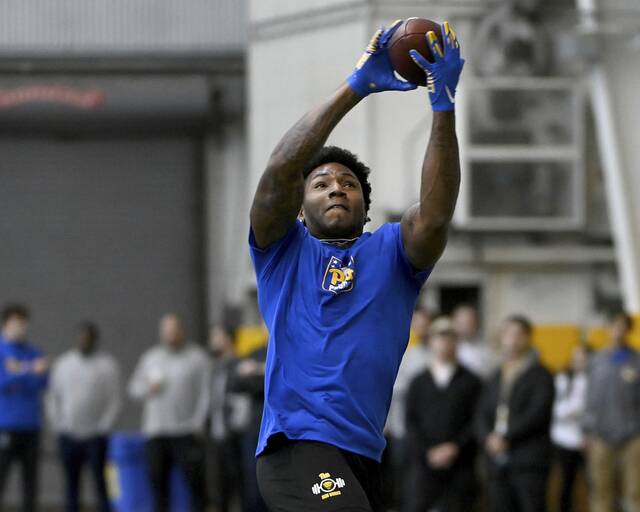 Pitt receiver Bub Means catches a pass at Pitt Pro Day on March 27 on the South Side.