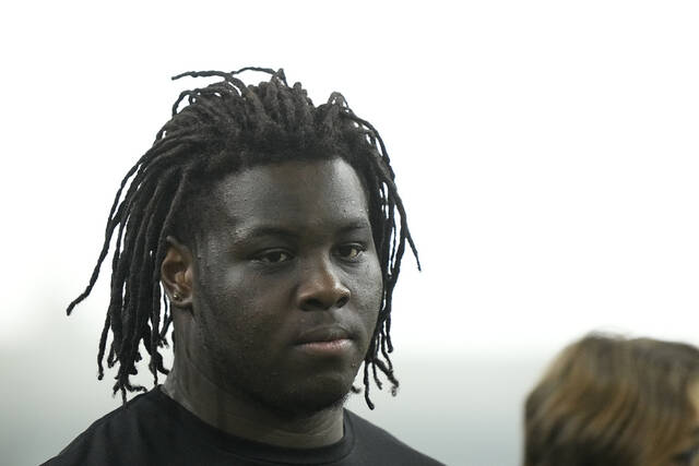 Amarius Mims watches from the sidelines during Georgia’s Pro Day in Athens.