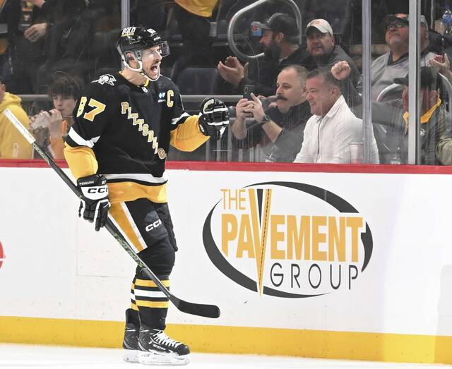 The Penguins’ Sidney Crosby celebrates his goal against the Red Wings in the second period Thursday, April 11, 2024, at PPG Paints Arena.