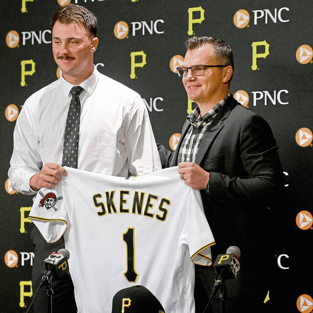 Pirates first round draft pick Paul Skenes stands with general manager Ben Cherington during a press conference on Tuesday, July 18, 2023, at PNC Park.