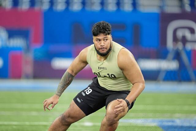 Shown while running a drill at the combine last month, Washington offensive lineman Troy Fautanu was selected by the Pittsburgh Steelers in the first round of the NFL draft on Thursday.