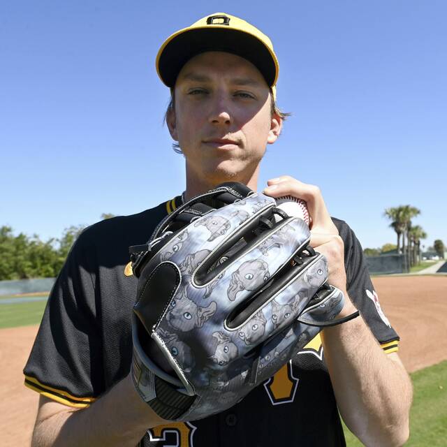 Pirates reliever Ryan Borucki shows off his “Dobby” cat glove after a workout on Tuesday, Feb. 20, 2024, at Pirate City.
