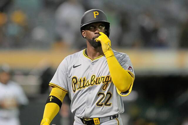 The Pirates’ Andrew McCutchen walks to the dugout after striking out against Oakland during the sixth inning Monday.