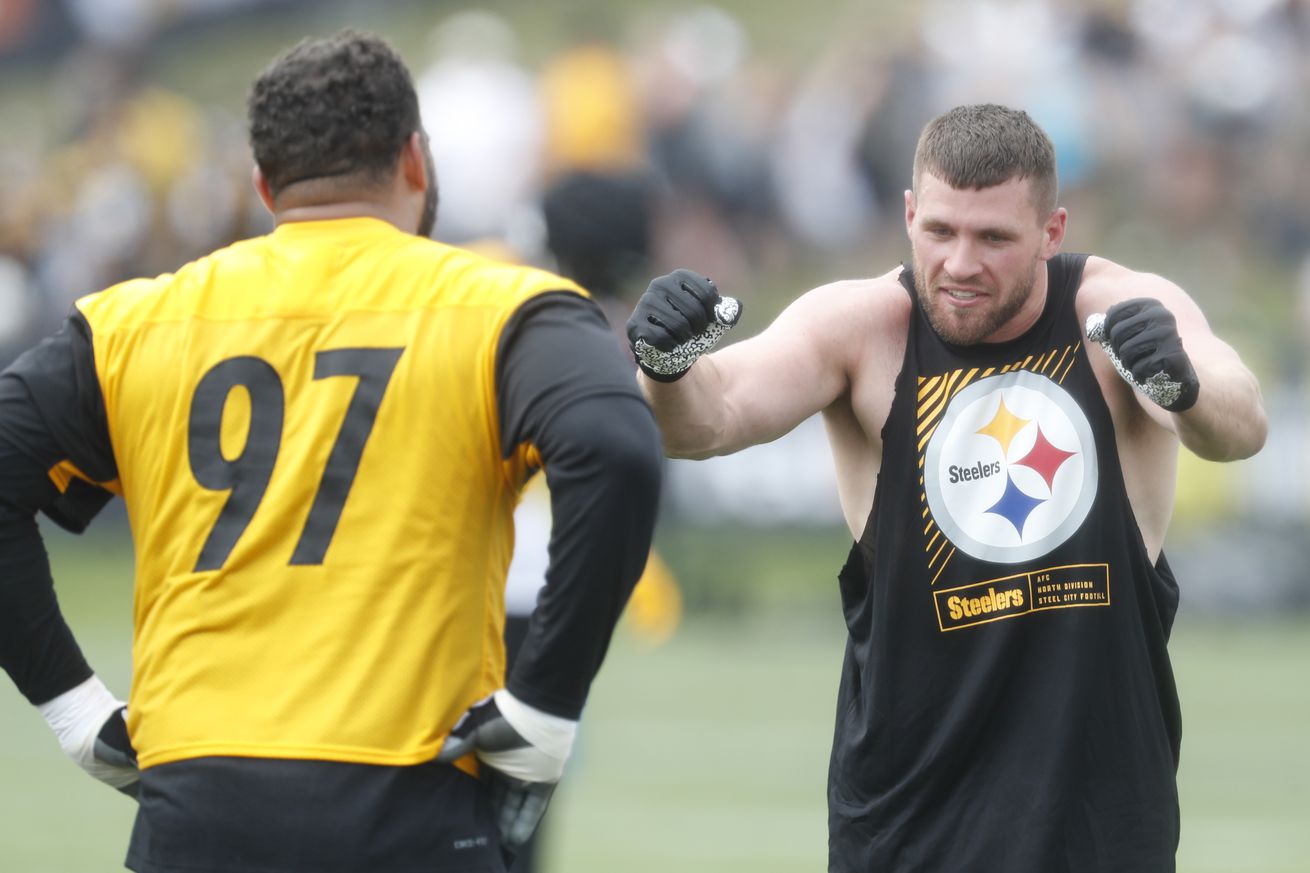 Steelers defensive tackle Cameron Heyward (97) and linebacker T.J. Watt (right) participate in drills during training camp at Saint Vincent College. Mandatory Credit: Charles LeClaire