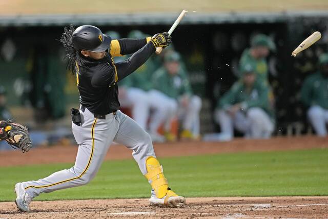 The Pirates’ Connor Joe breaks his bat hitting a single against Oakland during the fifth inning Tuesday.