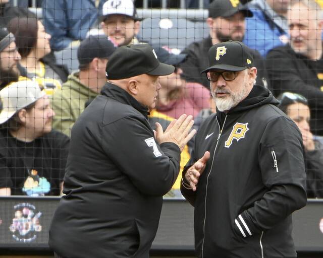 Pirates manager Derek Shelton talks with umpire crew chief Brian O’Nora between innings against the Red Sox on Sunday, Apr. 21, 2024, at PNC Park.