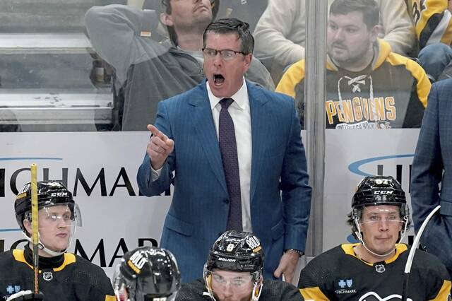 Pittsburgh Penguins head coach Mike Sullivan calls out instructions to his team during the third period of an NHL hockey game against the Nashville Predators, Monday, April 15, 2024, in Pittsburgh. (AP Photo/Matt Freed)