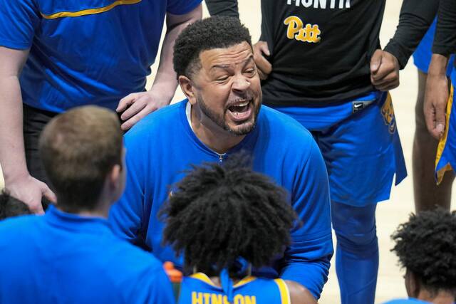 Pitt coach Jeff Capel gives instructions during a timeout against Louisville in a game last season.