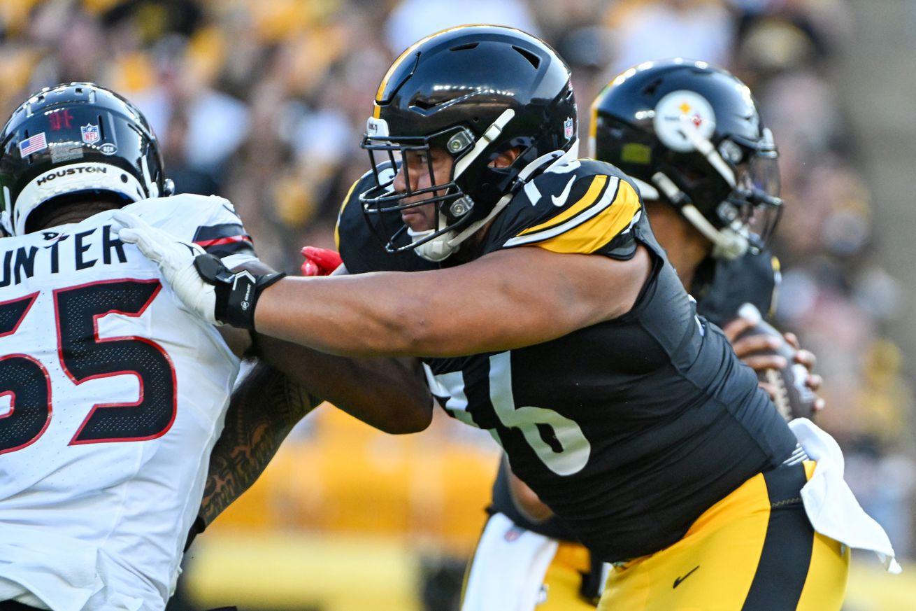 Pittsburgh Steelers offensive tackle Troy Fautanu (76) blocks Houston Texans defensive end Danielle Hunter (55) during the first quarter at Acrisure Stadium.