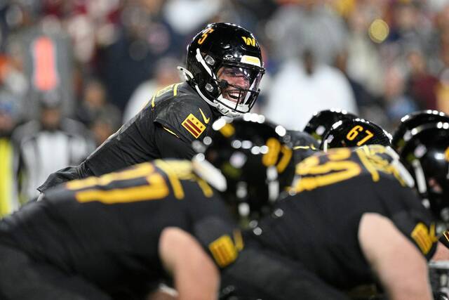 Washington Commanders quarterback Jayden Daniels (5) in action during the second half of an NFL football game against the Chicago Bears, Sunday, Oct. 27, 2024, in Landover, Md.