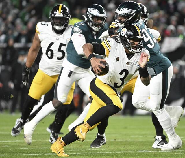 Steelers quarterback Russell Wilson takes off and runs against the Eagles in the second quarter Dec. 15, 2024 at FirstEnergy Stadium.