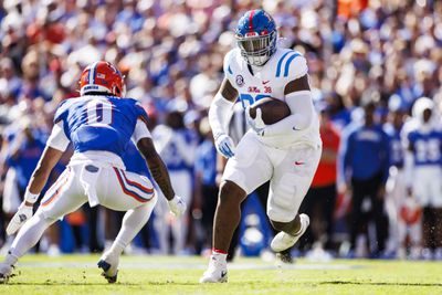JJ Pegues #89 of the Mississippi Rebels runs with the ball during the first half of a game against the Florida Gators at Ben Hill Griffin Stadium on November 23, 2024 in Gainesville, Florida.