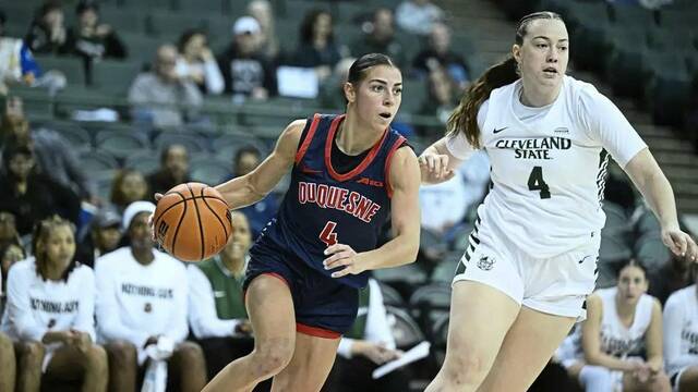 Duquesne’s Megan McConnell drives past Cleveland State’s Grace Ellis during a Women’s NIT round of 16 game Friday, March 28, 2025.