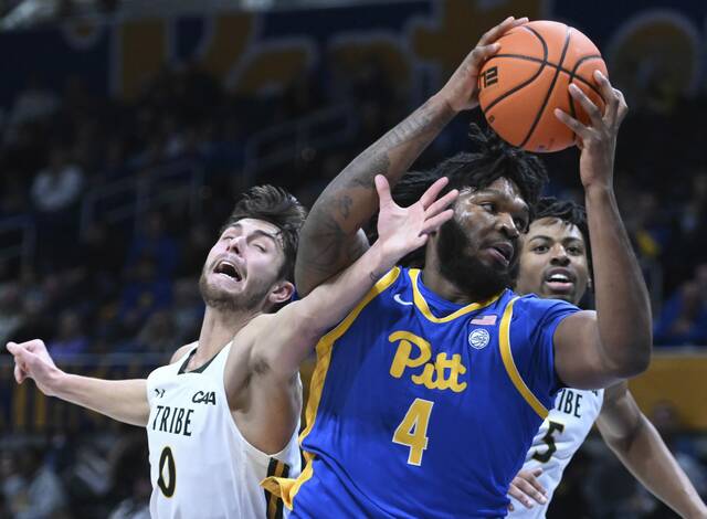 Pitt’s John Hugley IV grabs a rebound from William & Mary’s Anders Nelson in the first half Friday, Nov. 25, 2022 at Petersen Events Center.
