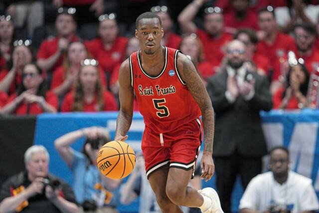 Saint Francis guard Daemar Kelly (5) controls the ball during a First Four college basketball game against Alabama State in the NCAA Tournament, Tuesday, March 18, 2025, in Dayton, Ohio.