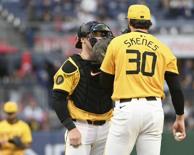 Pirates catcher Henry Davis talks with pitcher Paul Skenes on the mound during a game against the Brewers on Friday, May 23, 2025, at PNC Park.