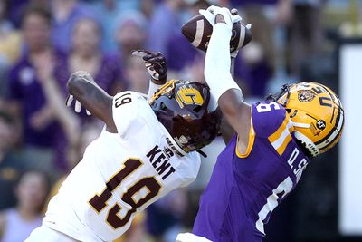 Deion Smith #6 of the LSU Tigers catches a touchdown pass over Donte Kent #19 of the Central Michigan Chippewas during the first quarter at Tiger Stadium on September 18, 2021 in Baton Rouge, Louisiana.