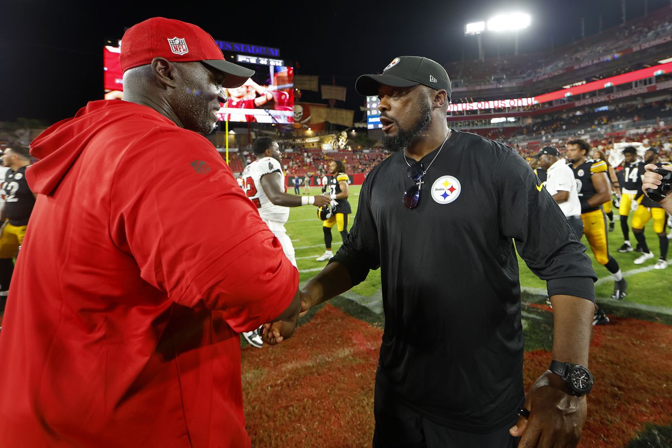 Tampa Bay Buccaneers head coach Todd Bowles and Pittsburgh Steelers head coach Mike Tomlin shake hands during a preseason game against the Pittsburgh Steelers at Raymond James Stadium on August 11, 2023 in Tampa, Florida.