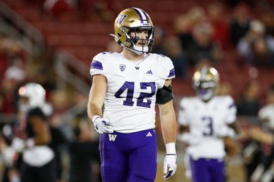 Carson Bruener #42 of the Washington Huskies looks on during a game against the Stanford Cardinal at Stanford Stadium on October 28, 2023 in Stanford, California.
