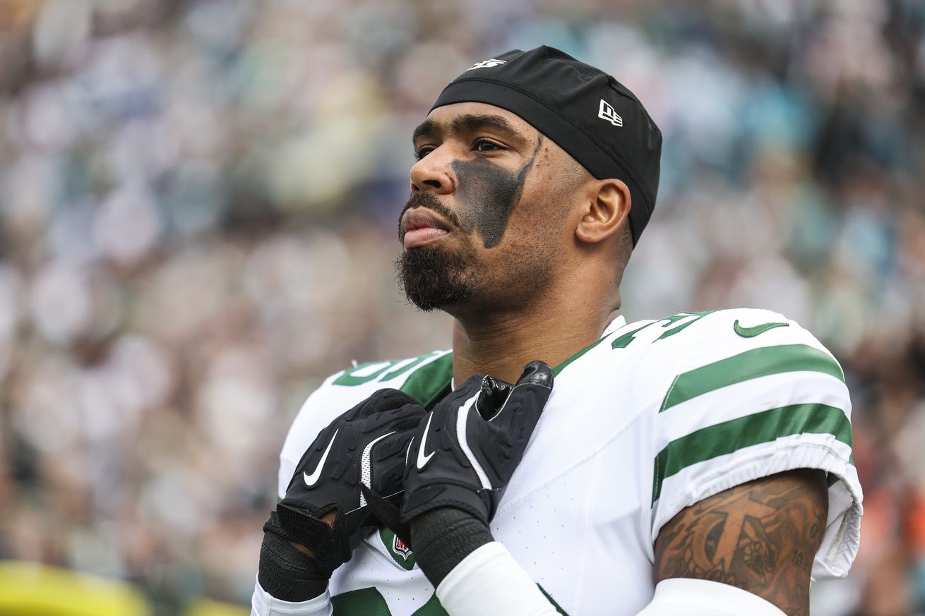 Chuck Clark #36 of the New York Jets looks on from the sideline during the national anthem prior to an NFL football game against the Jacksonville Jaguars at EverBank Stadium on December 15, 2024 in Jacksonville, FL.