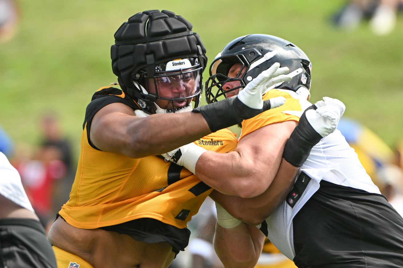 Pittsburgh Steelers defensive tackle Derrick Harmon (99) battles center Zach Frazier (54) during drills during training camp at Saint Vincent College.&nbsp;