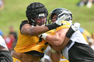 Pittsburgh Steelers defensive tackle Derrick Harmon (99) battles center Zach Frazier (54) during drills during training camp at Saint Vincent College.