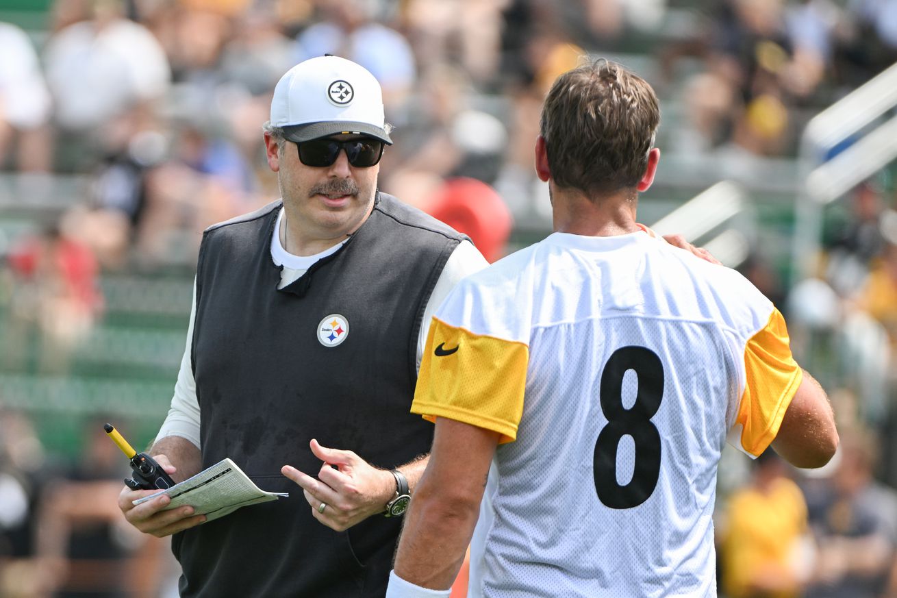Pittsburgh Steelers offensive coordinator Arthur Smith talks with quarterback Aaron Rodgers (8) during drills at training camp at Saint Vincent College.