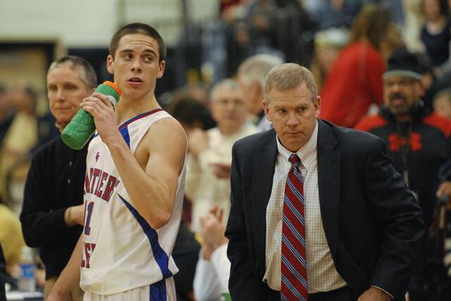 From March 2, 2010: Chartiers Valley’s T.J. McConnell stands with his father and head boys basketball coach, Tim, at their WPIAL semifinal game against West Allegheny at North Allegheny High School.
