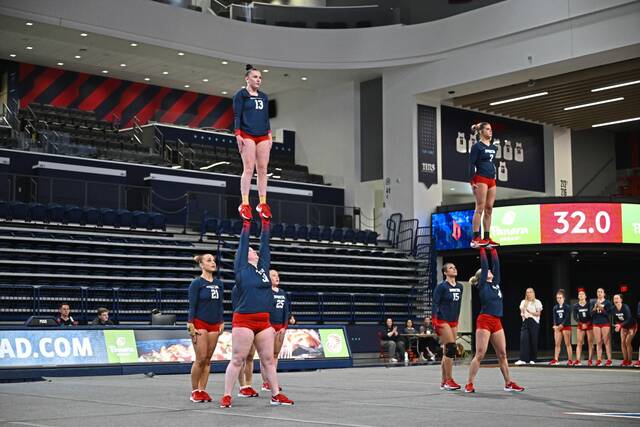 Freeport grad Abby Eberle (top left) was part of a class of 31 freshmen on Duquesne’s inaugural acrobatics and tumbling team.