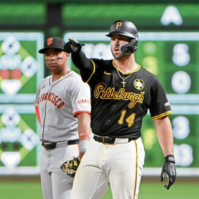 Pirates catcher Joey Bart points to the dugout after driving in the tying run during the ninth inning against the Giants on Monday, Aug. 4, 2025, at PNC Park.