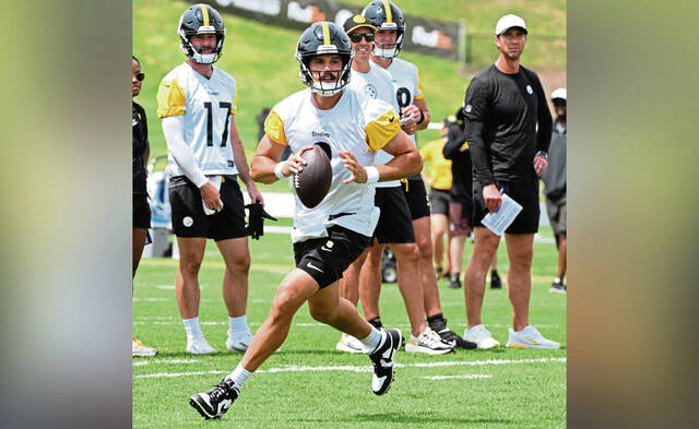 Steelers quarterback Mason Rudolph rolls out during practice Aug. 2 at Saint Vincent College.