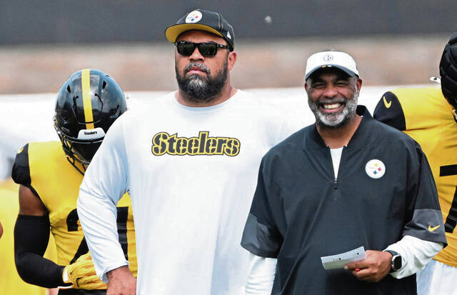 Steelers Cameron Heyward stands next to defensive coordinator Teryl Austin on Thursday at Saint Vincent College.