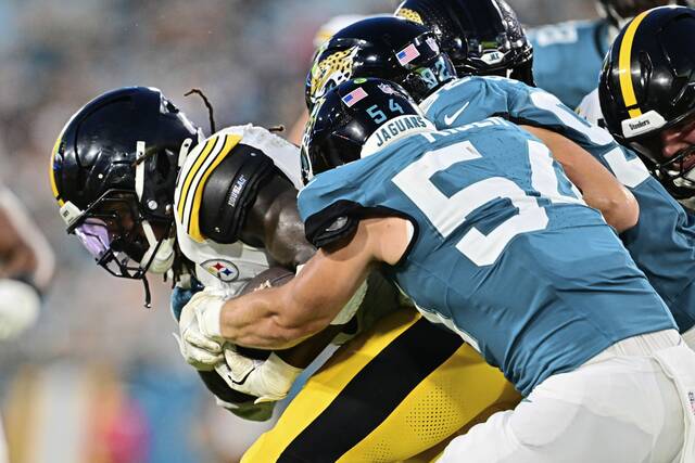 Steelers running back Kaleb Johnson is tackled by the Jaguars’ Jack Kiser in the first half of Saturday’s preseason game in Jacksonville.