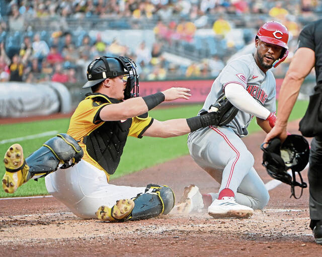 Pirates catcher Henry Davis tags out the Reds’ Miguel Andujar at home plate during the fourth inning on Friday, Aug. 8, 2025, at PNC Park.